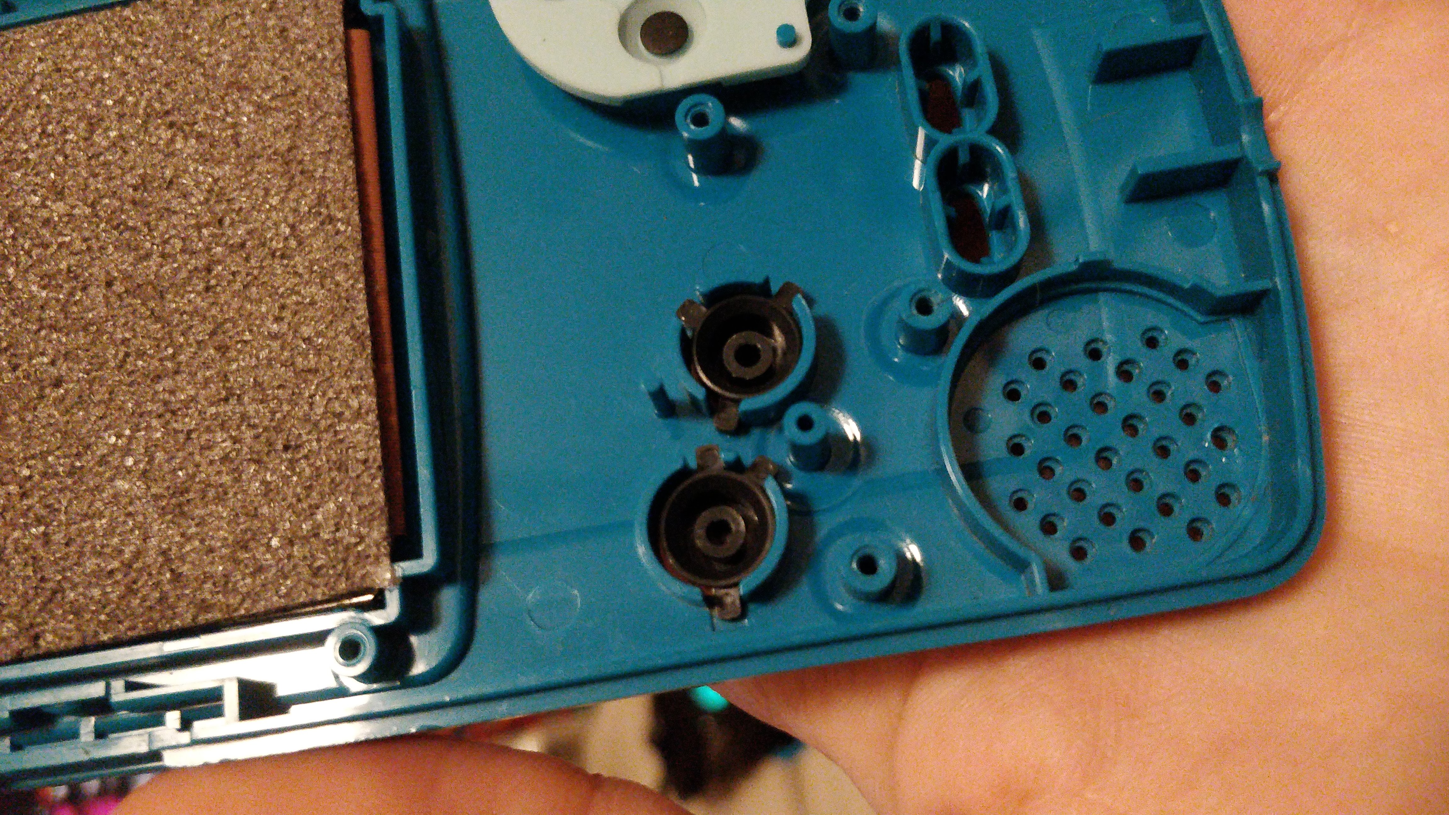 Gameboy Color button pieces in the front piece of the case